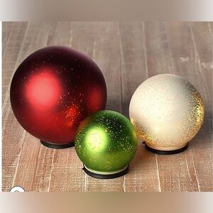 Set of three indoor outdoor lit mercury glass spheres by Valerie Parr Hill